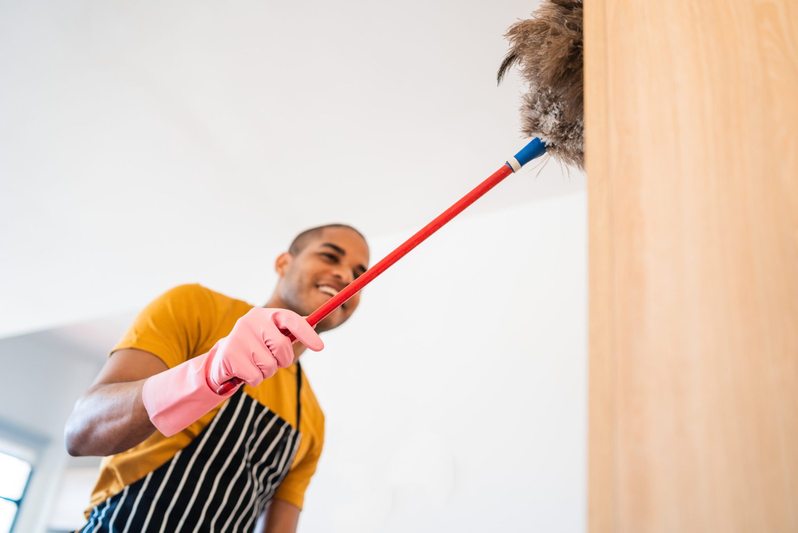 portrait-of-young-latin-man-cleaning-his-new-house-2025-10-17-05-44-56-utc